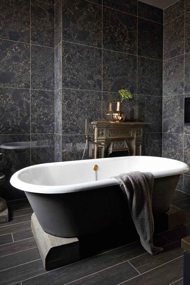 dark grey modern bathroom with freestanding bath