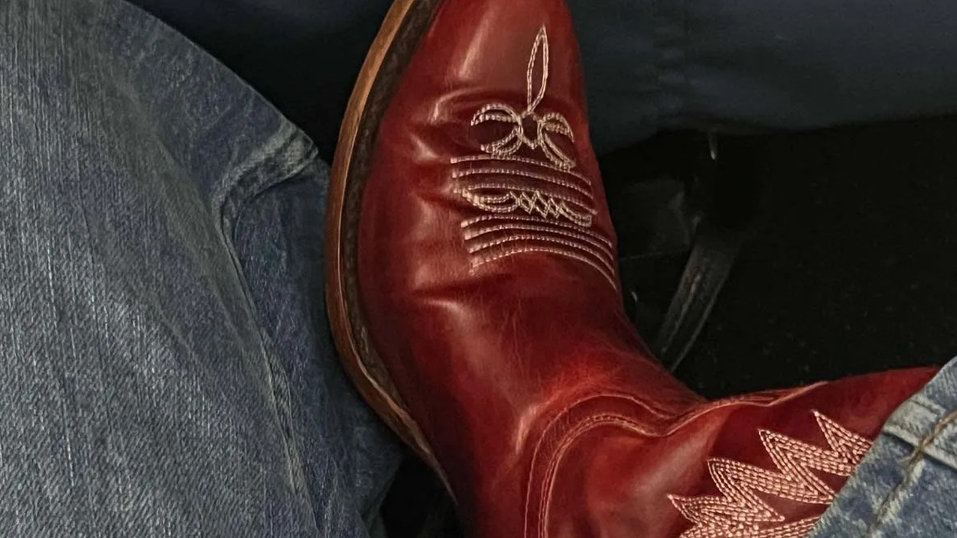 sierra mayhew wearing cowboy boots and jeans