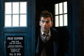 David Tennant as The Doctor leaning out of the TARDIS