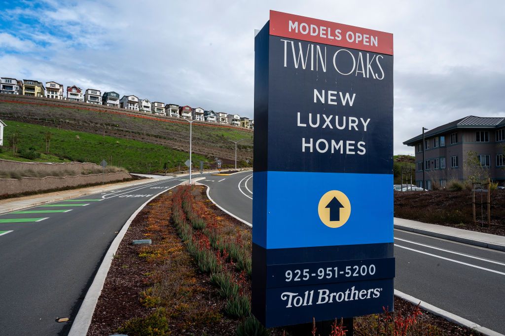 A Toll Brothers Twin Oaks housing community sign