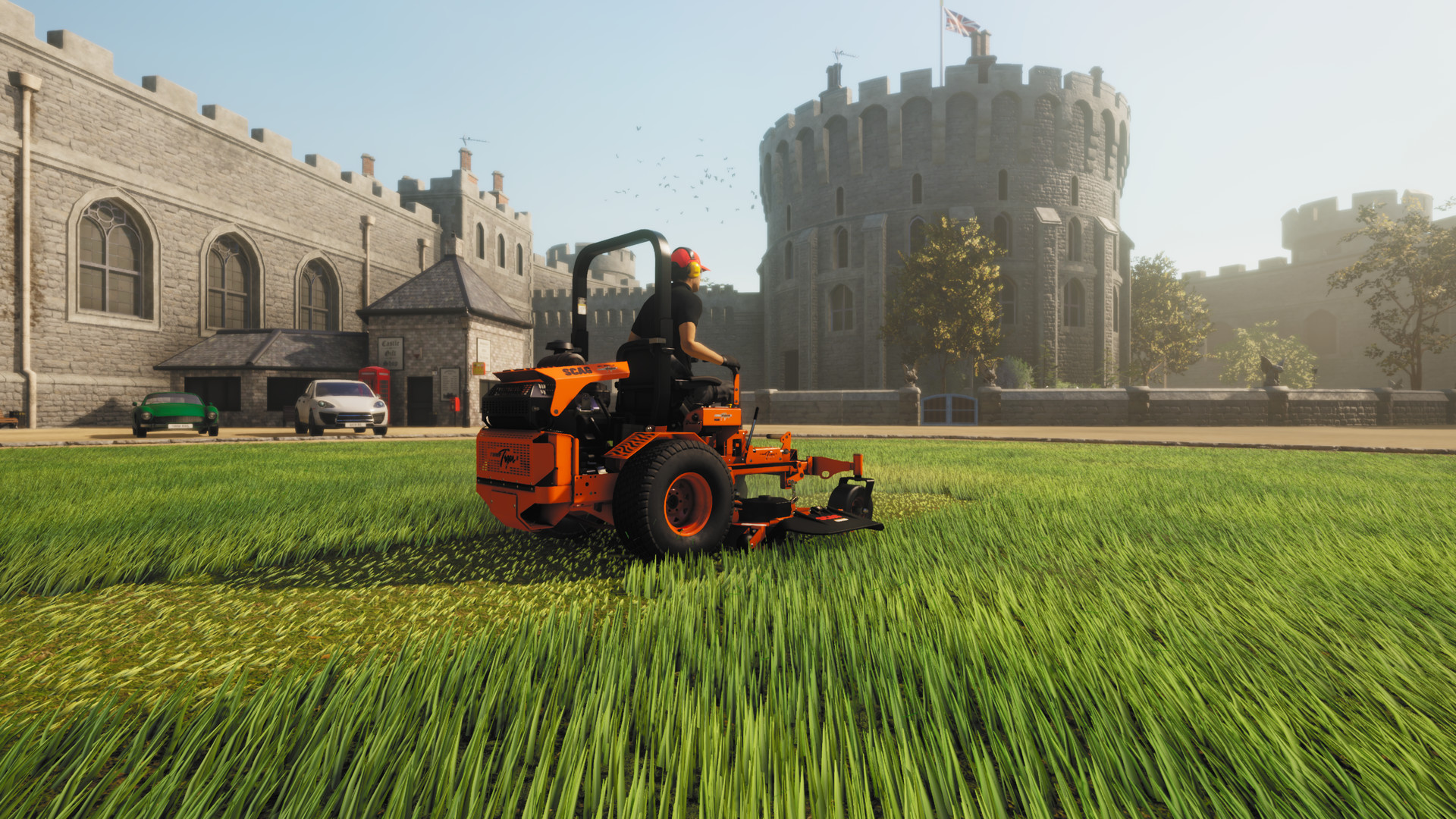 Mowing a lawn near a castle