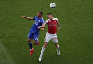 Youri Tielemans and Arsenal’s Granit Xhaka challenge for the ball