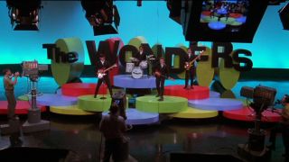 A wide shot of the band on the Hollywood Television Showcase set in That Thing You Do!