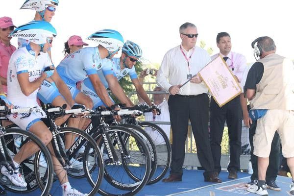 Gerolsteiner awaits their start, while UCI president Pat McQuaid stands by