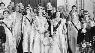 Queen Elizabeth poses with her family and members of the royal family in the throne room at Buckingham Palace, after her coronation