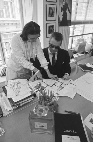 Karl Lagerfeld working on sketches at Chanel