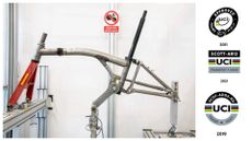 Brompton frameset being ISO tested on the left, and UCI frame sticker logos on the right