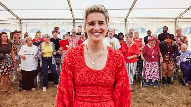 Vicky McClure in front of a choir