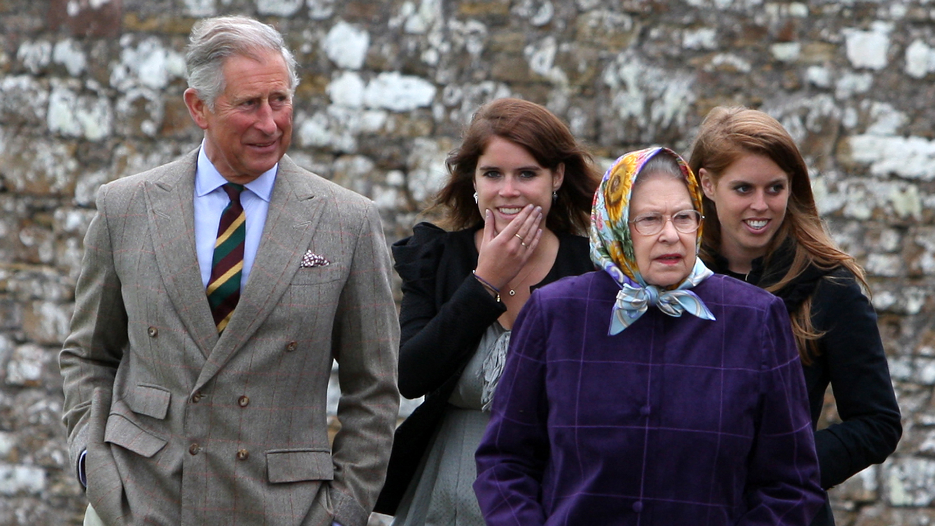 SCRABSTER, UNITED KINGDOM - AUGUST 02: Queen Elizabeth II (R) accompanied by Prince Charles, Prince of Wales (L), Princess Eugenie, (C), and Princess Beatrice and the rest of the Royal family arrive at the Castle of Mey after disembarking the Hebridean Princess boat after a private family holiday around the Western Isles of Scotland, on August 02, 2010 in Scrabster, Scotland. (Photo by Andrew Milligan - WPA Pool/Getty Images)