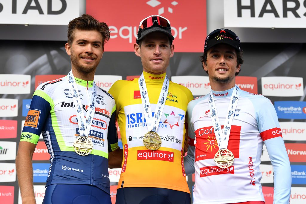 HARSTAD NORWAY AUGUST 08 LR Odd Christian Eiking of Norway and Team Intermarch Wanty Gobert Matriaux Ben Hermans of Belgium and Team Israel StartUp Nation Yellow Leader Jersey Victor Lafay of France and Team Cofidis White Best Young Rider Jersey celebrate at final podium during the 8th Arctic Race Of Norway 2021 Stage 4 a 1635km stage from Gratangen to Harstad 54m ArcticRace on August 08 2021 in Harstad Norway Photo by Stuart FranklinGetty Images