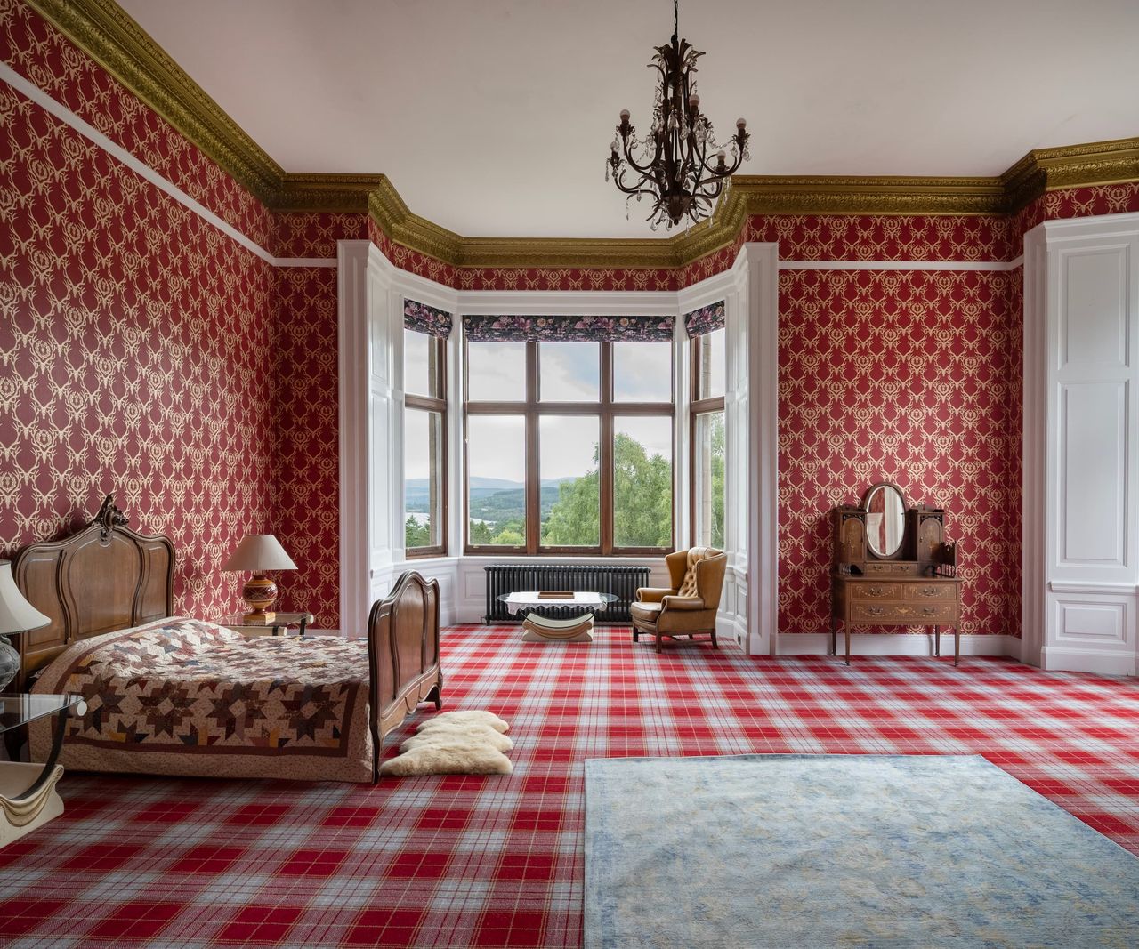 A bedroom with a chequered carpet in a Victorian style