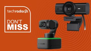 two black webcams against orange background