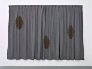 An image of curtain with stains
