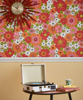 Retro pink wallpaper on upper half of wall with vintage record player