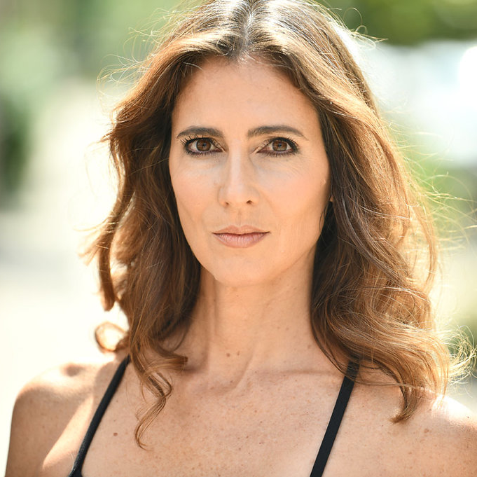 Head and shoulders of woman looking at camera