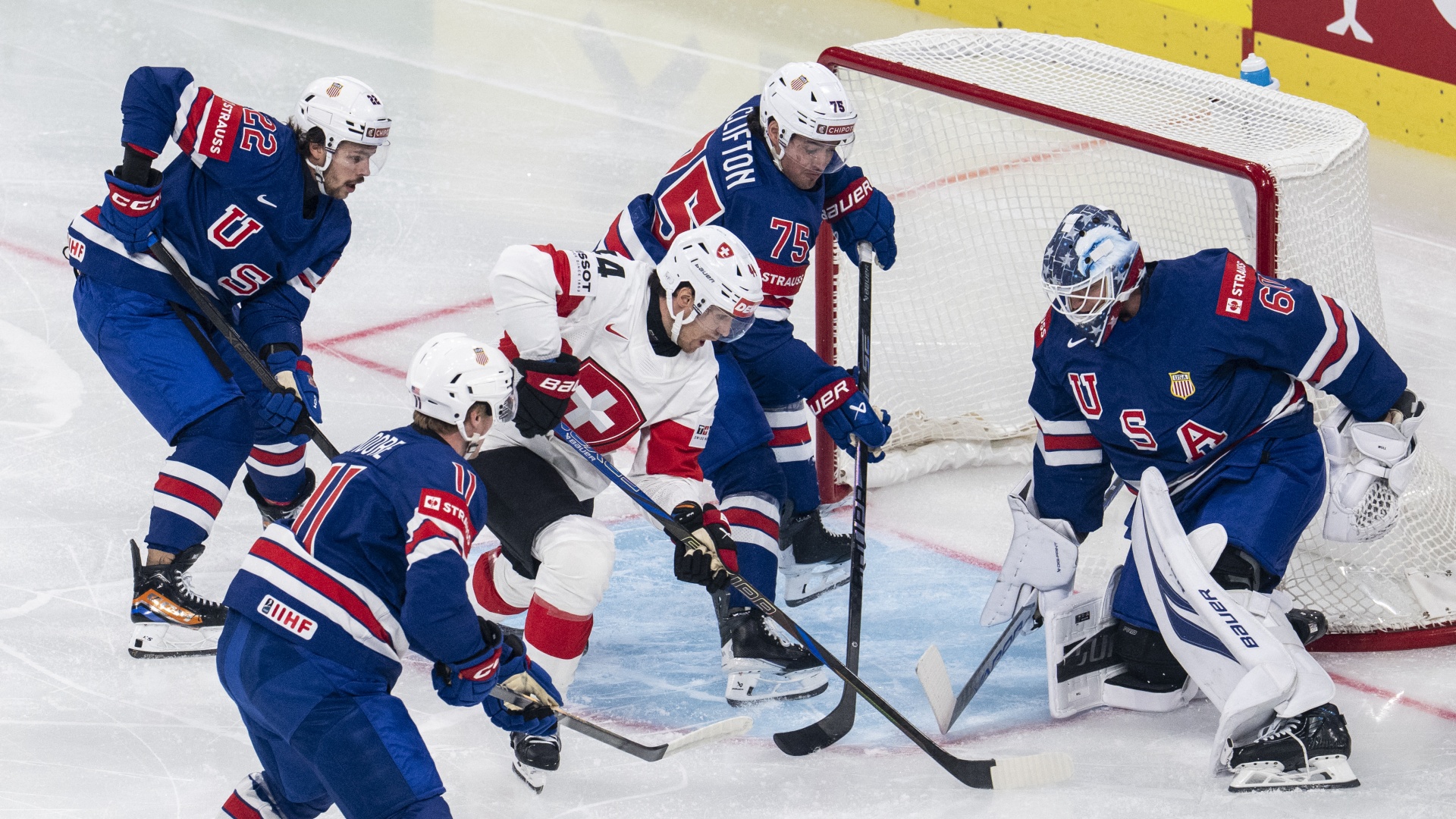 Switzerland's Pius Suter scores against USA's Joseph Woll at the 2026 IIHF World Championship