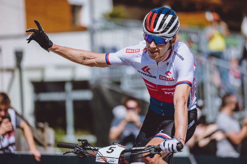 Czech Republics Ondrej Cink reacts after arriving second in the Mens Cross Country competition of the UCI Mountain Bike World Cup in Leogang Austria on June 13 2021 Austria OUT Photo by JFK various sources AFP Austria OUT Photo by JFKEXPAAFP via Getty Images