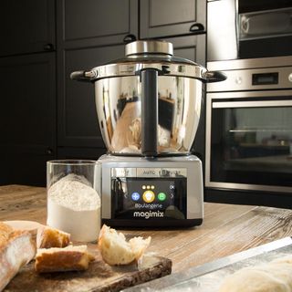 Magimix cooker on a table with flour and bread