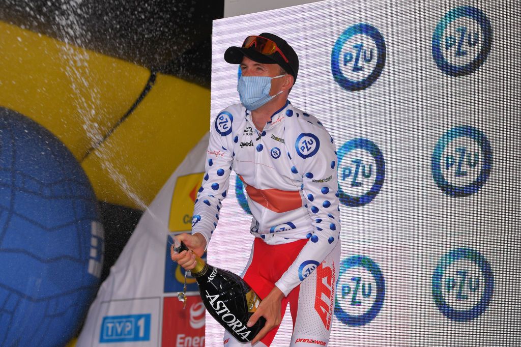 KRAKOW POLAND AUGUST 09 Podium Patryk Stosz of Poland and Team Poland Polka Dot Mountain Jersey Celebration Champagne during the 77th Tour of Poland 2020 Stage 5 a 188km stage from Zakopane to Krakow TourdePologne tdp20 on August 09 2020 in Krakow Poland Photo by Luc ClaessenGetty Images