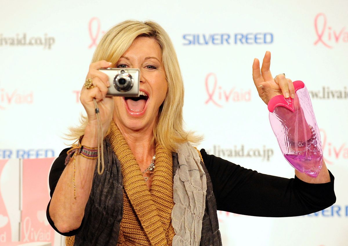 Olivia Newton-John with camera