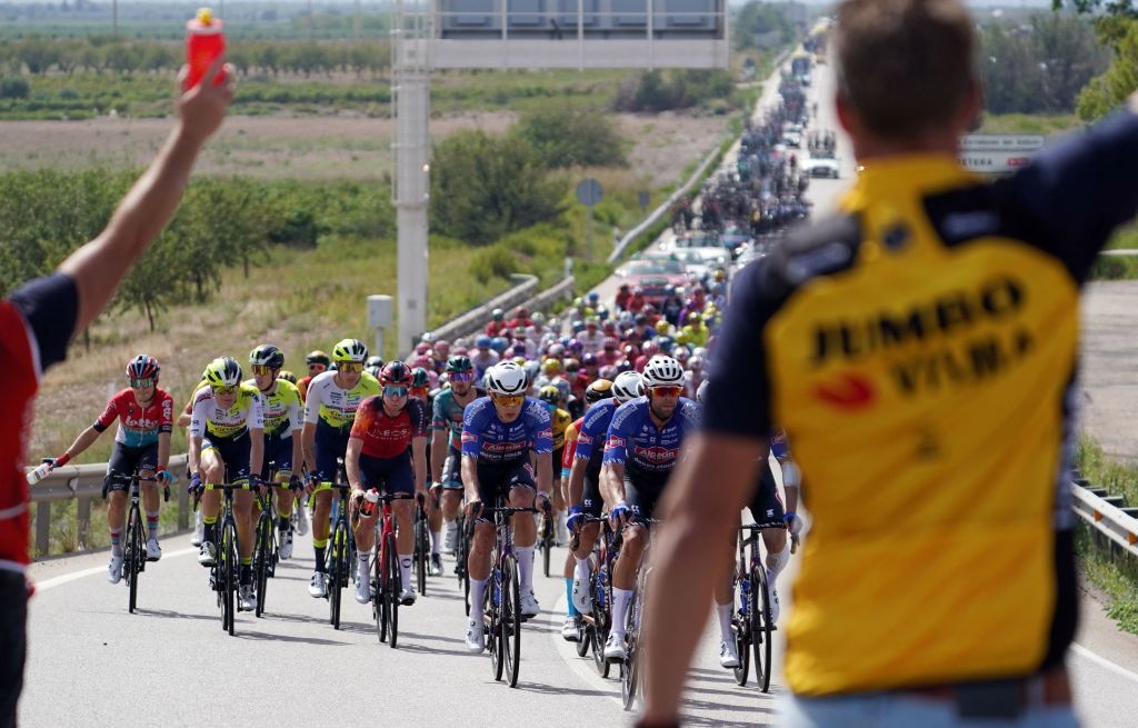 Cyclists ride in a pack in Tauste during the stage 12 of the 2023 La Vuelta cycling tour of Spain a 1506 km race between Olvega and Zaragoza on September 7 2023 Photo by CESAR MANSO AFP Photo by CESAR MANSOAFP via Getty Images
