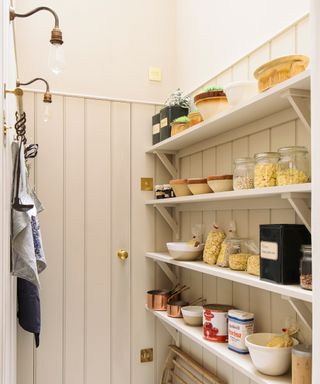 Pantry with open shelves and tongue and groove paneling