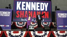 Independent presidential candidate Robert F. Kennedy Jr. (R) and his vice presidential pick Nicole Shanahan take the stage during a campaign event
