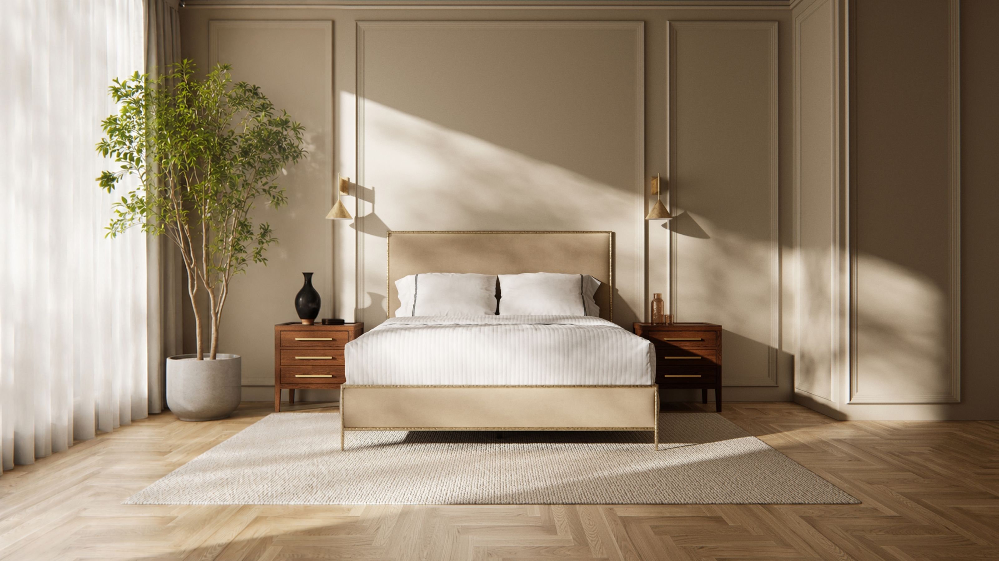 Saatva Regis bedframe in a neutral bedroom with panelled walls, wooden flooring, dark wood matching nightstands, a large tree and sheer white curtains.