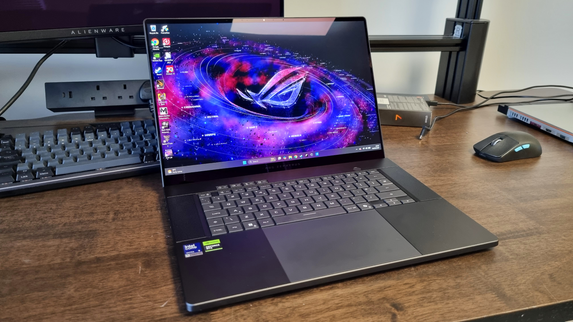 An Asus ROG Zephyrus G16 2026 shot from various angles on a test bench