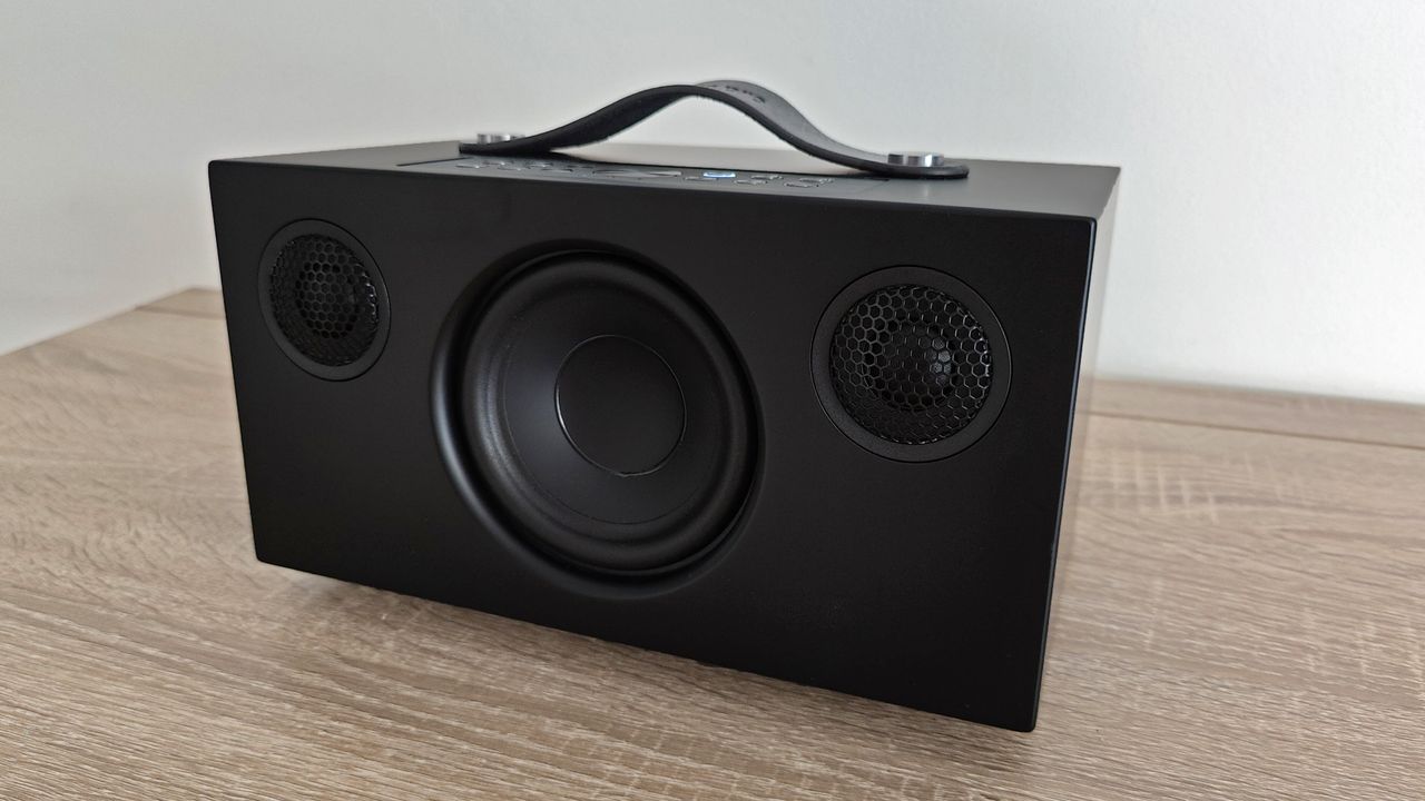 Audio Pro C5 Mk II review: black speaker on a wooden desk by a white wall