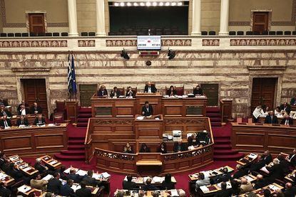 Greek Prime Minister Alexis Tsipras delivers a speech during a parliamentary session in Athens on Sunday.
