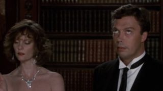 Wadsworth rolling his eyes next to Miss Scarlet in Clue