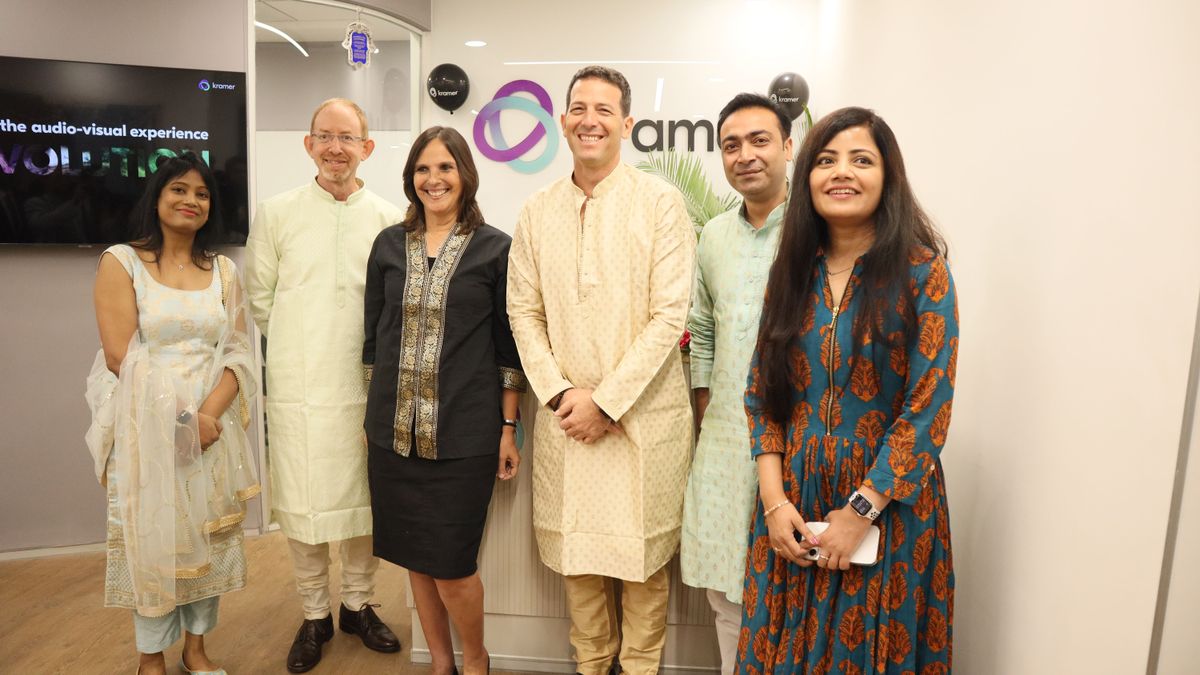 Five smiling people as Kramer opens its R&amp;D Center in India.