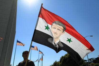 A flag depicting Syrian President Bashar al-Assad
