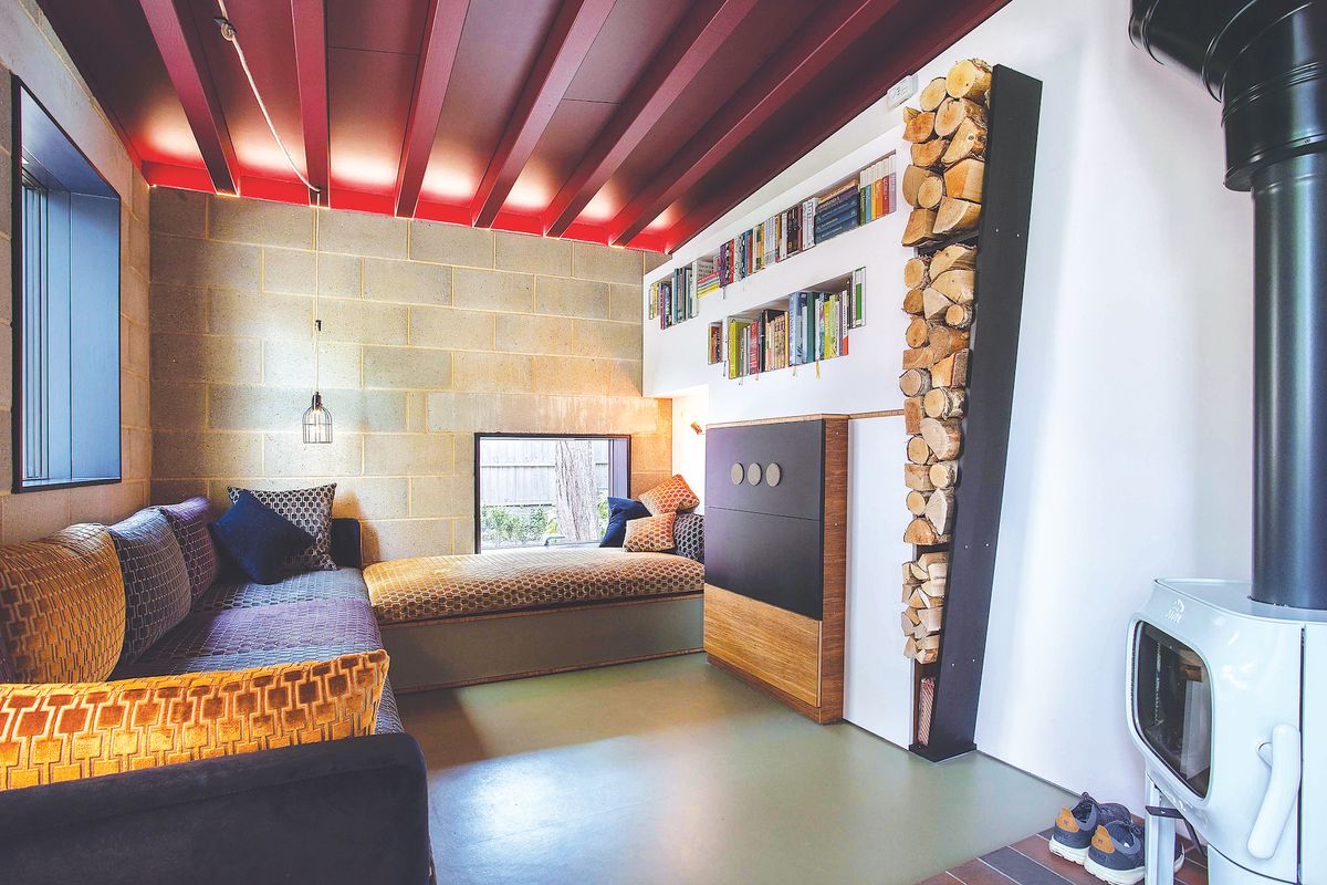 modern interior design in small snug with log store