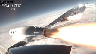 The rocket engine of the Virgin Galactic space plane is ignited and rocketed the ship to space.