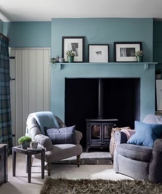 Living room with blue walls in country house in Wiltshire