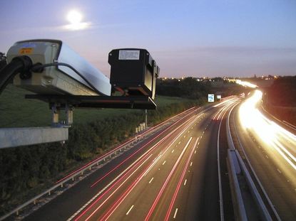 Voters ban red light cameras; city councils sue voters to bring them back