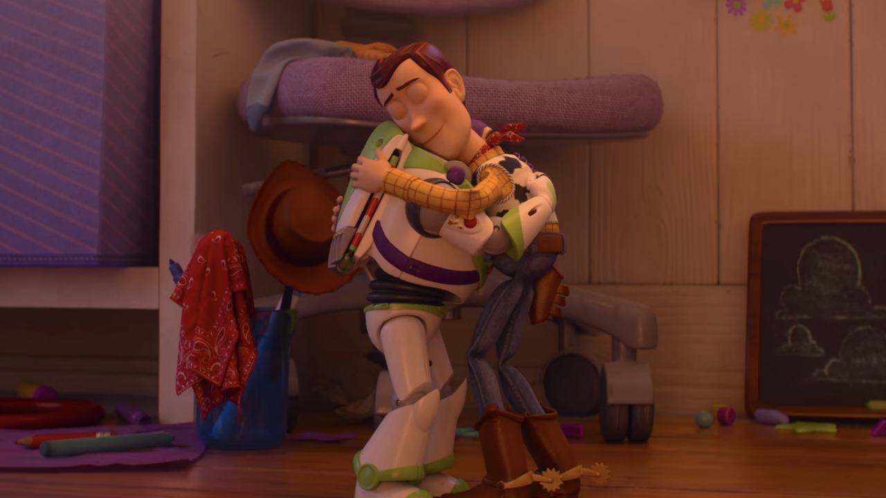 Buzz and Woody hugging in Toy Story 5