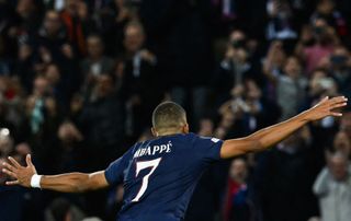 Kylian Mbappe celebrates scoring PSG's first goal during the UEFA Champions League group H football match between Paris Saint-Germain and SL Benfica, at The Parc des Princes Stadium, on October 11, 2022.