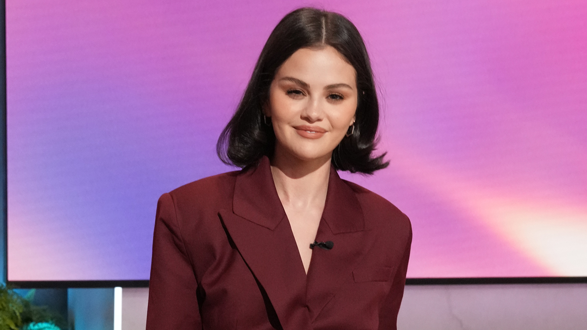 Selena Gomez appeared on the Jennifer Hudson show in a burgundy suit-inspired jumpsuit 