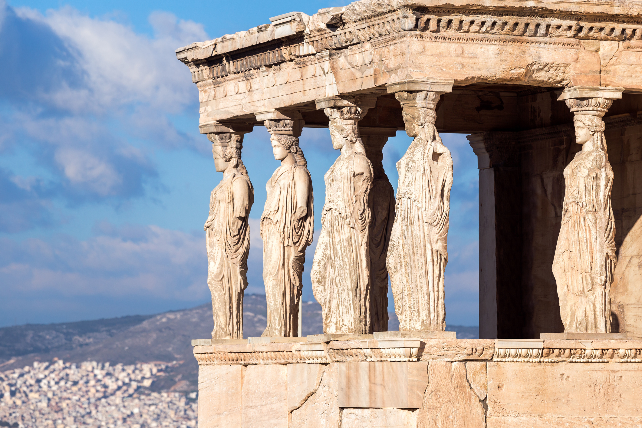 The Erechtheion (Erechtheum), Temple of Athena near the Pantheon at the Acropolis, Athens, GreeceThe temple honors Athena and Poseidon, featuring a porch with 6 caryatids.