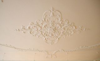 The ceiling's plaster centrepiece was moulded from an original in the next door Hartnell Building