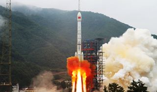 A Chinese Long March 3B rocket launches the military space debris mitigation satellite Shijian-21from the Xichang Satellite Launch Center on Oct. 24, 2021.
