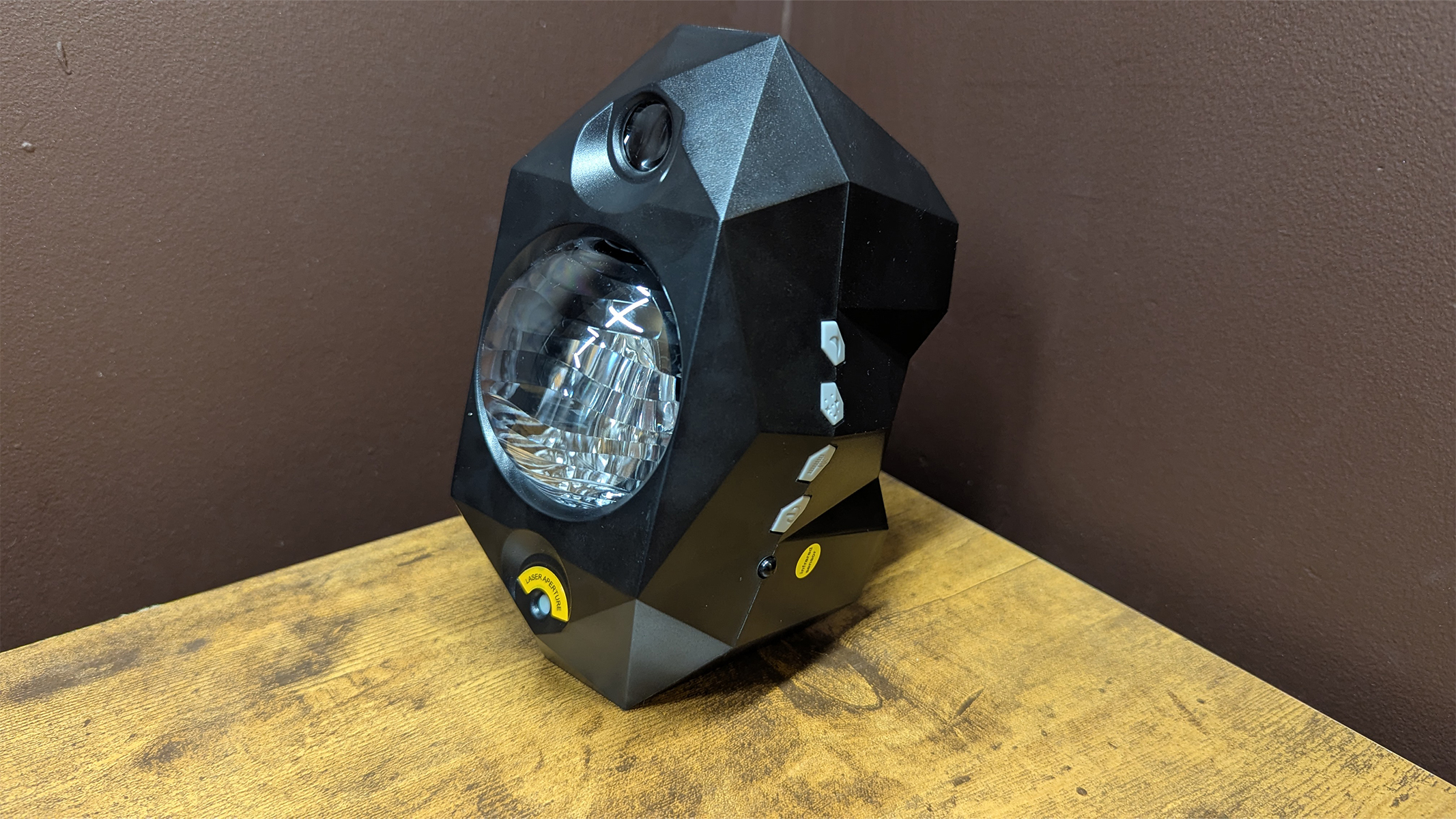 Cadrim Star Projector on a wooden table