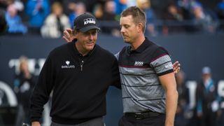 Henrik Stenson (R) and Phil Mickelson (L) embrace after the final round of the 2016 Open at Royal Troon