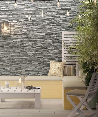 Porcelain tiles creating a textured effect grey wall in a garden seating area