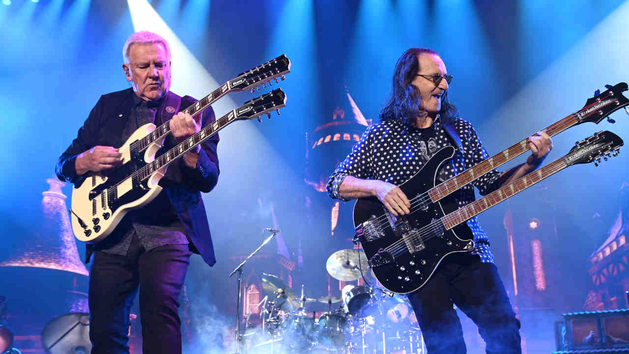 Rush’s Alex Lifeson and Geddy Lee performing onstage in LA on June 7