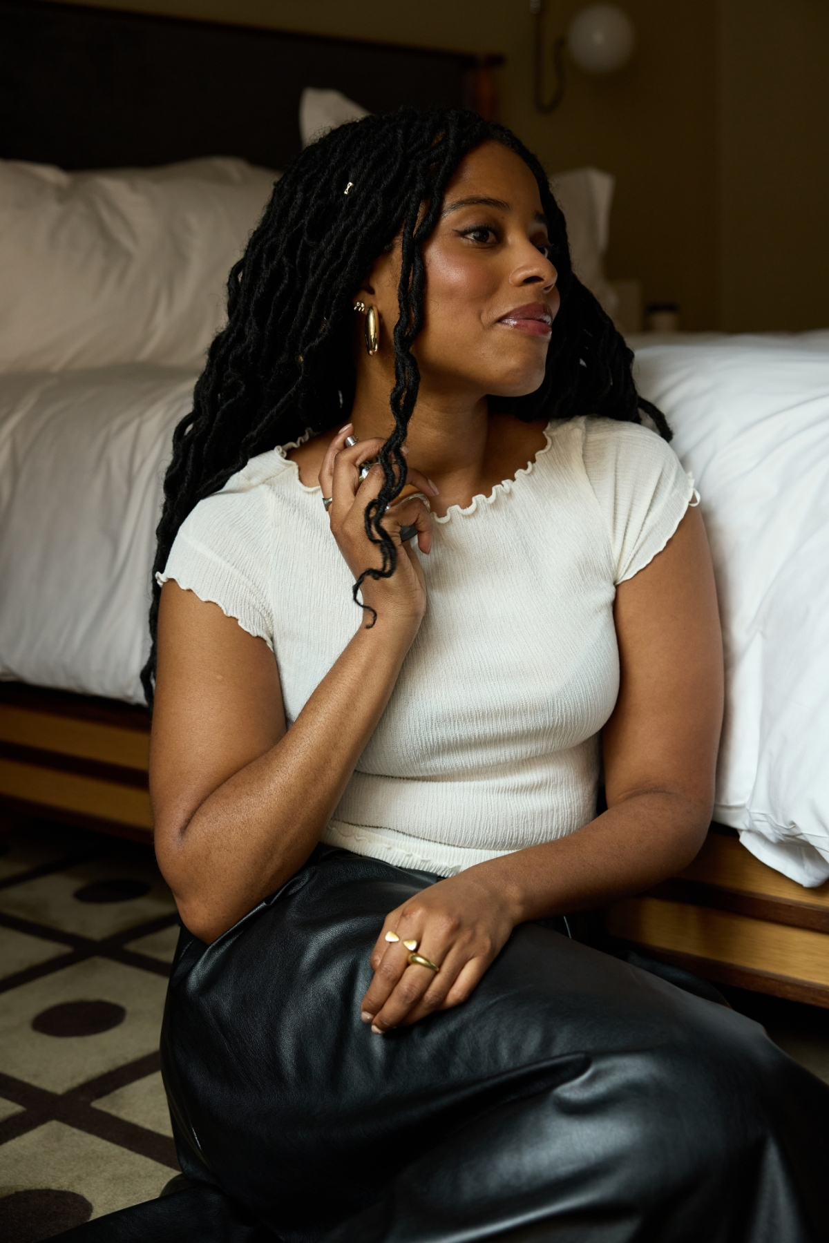 Branded content editor Felicia Pennant spraying a bottle of Givenchy L'Interdit