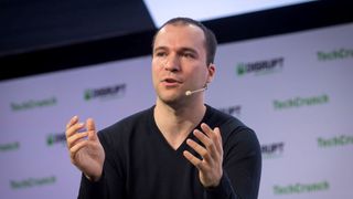 Greg Brockman, co-founder and chief technology officer of OpenAI Inc, speaking on stage during TechCrunch Disrupt 2019